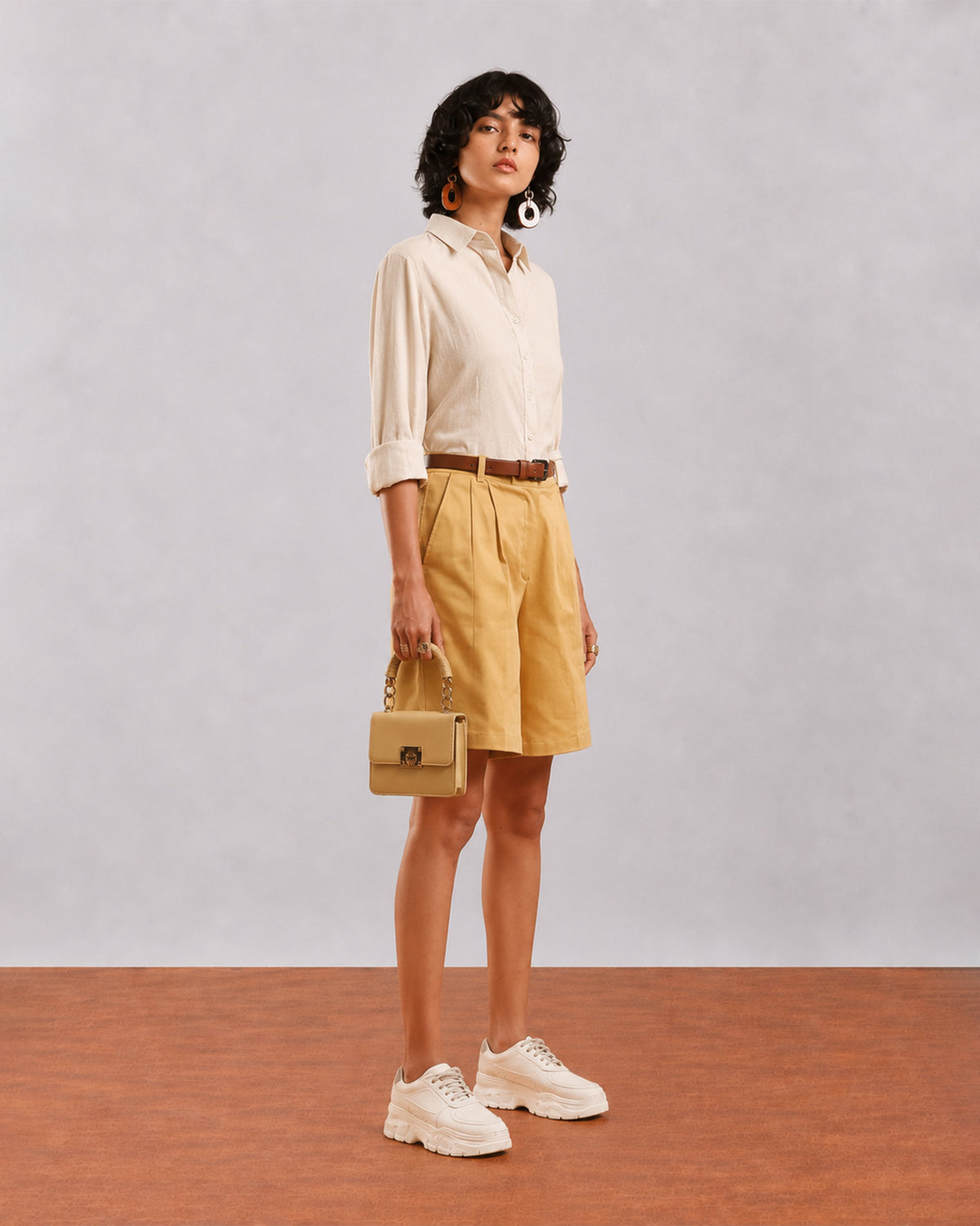 Side view of Caleb light grey viscose linen shirt showing relaxed fit and rolled sleeves