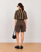 Back view of Carter chocolate brown bermuda shorts showing back welt pocket and waistband