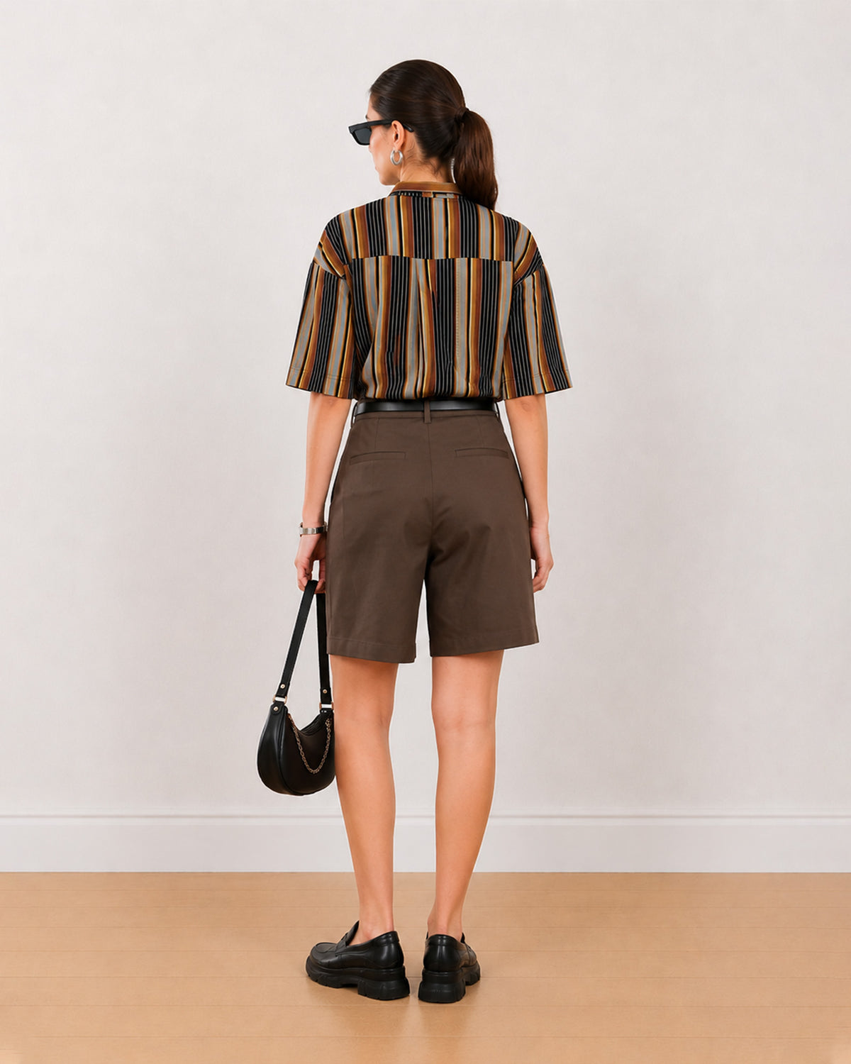 Back view of Carter chocolate brown bermuda shorts showing back welt pocket and waistband