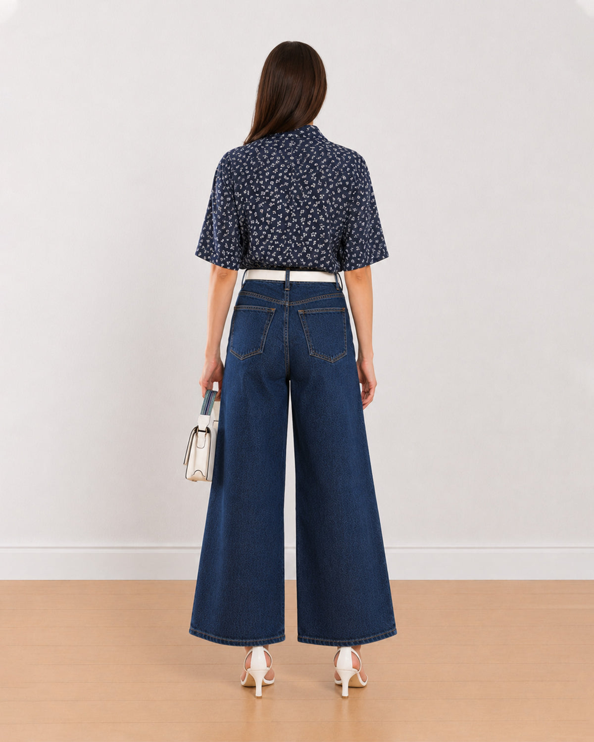 Back view of Cece indigo printed cropped shirt showing back yoke and straight cropped hem