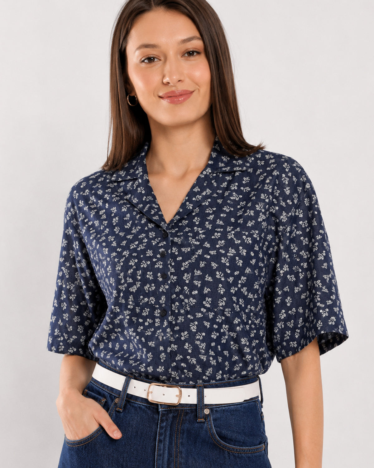 Close-up of Cece indigo ditsy floral print with notched collar and short sleeves