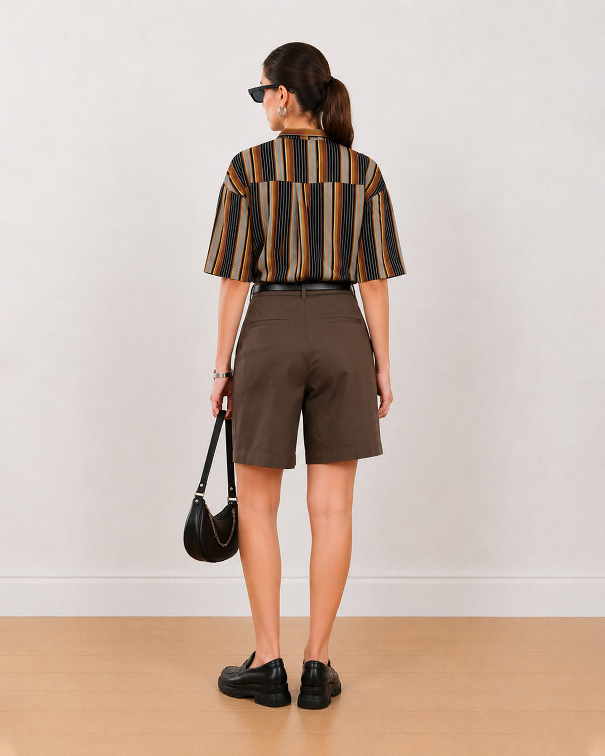 Back view of Cecil brown striped cropped shirt showing back yoke and vertical stripes