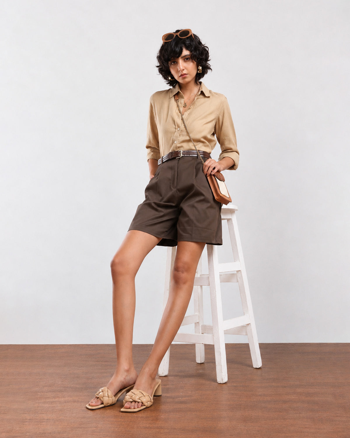 Charlie beige cotton formal shirt seated front view worn tucked in with rolled sleeves