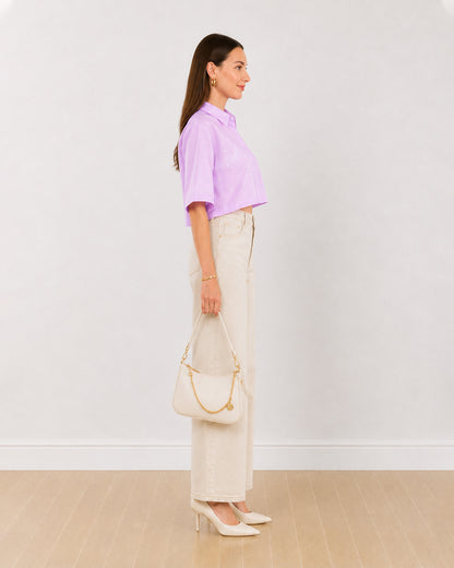 Side view of Christian lavender 100% cotton cropped shirt with boxy fit and extended shoulders
