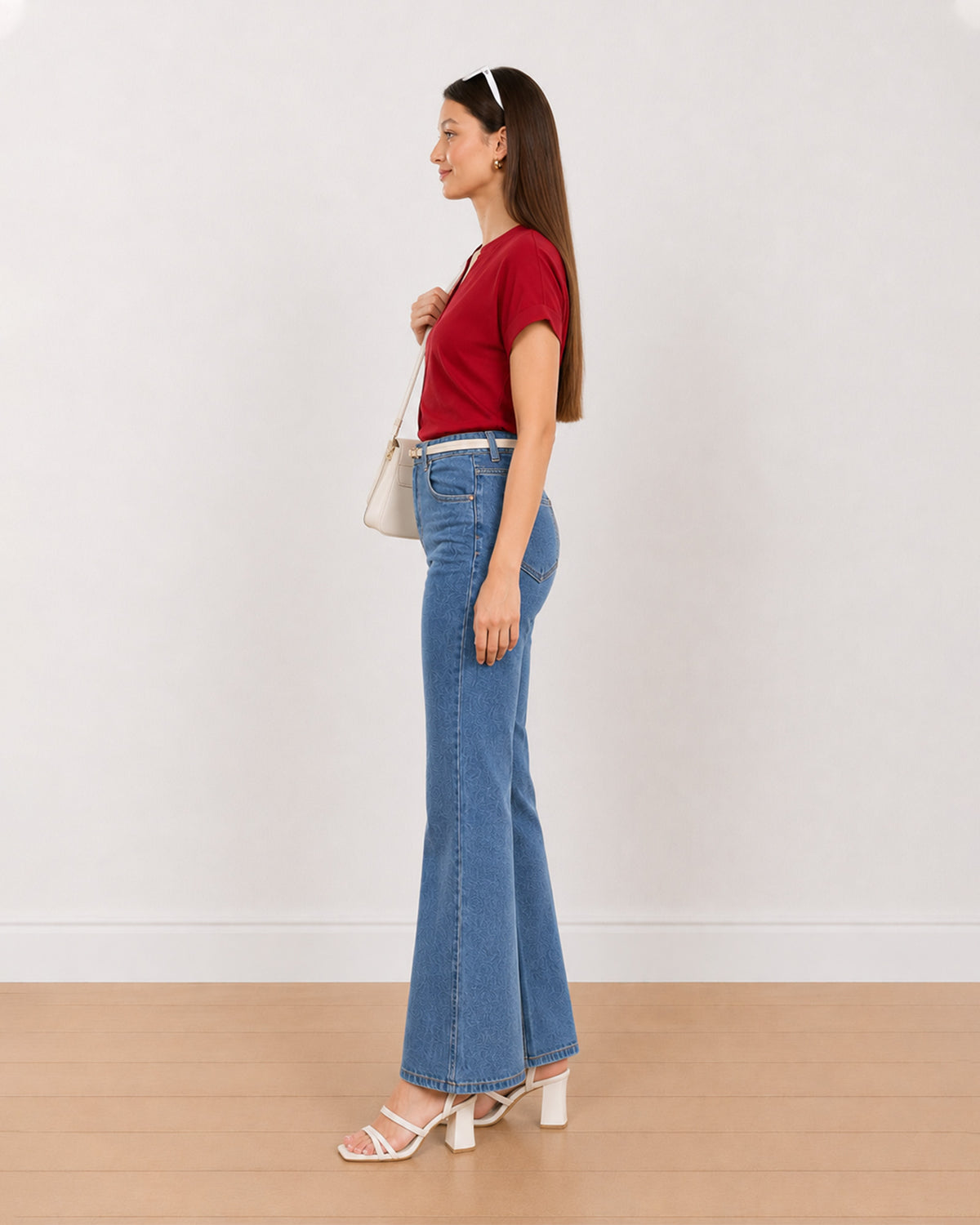Side view of Claire red 100% rayon formal top worn tucked in with a boxy fit