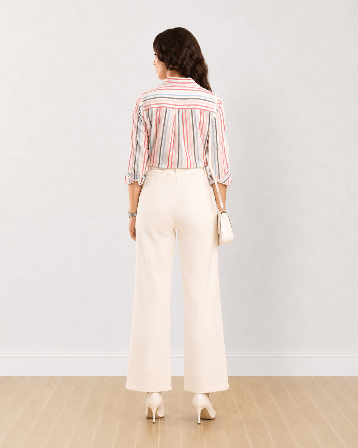 Dali striped cotton shirt, back view showing the yoke cut across the stripes and centre back pleat