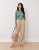 Dame sage green formal shirt with full sleeves and a classic collar, angled front view
