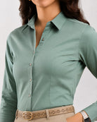 Close-up of Dame sage green shirt placket with hidden dignity buttons and bust darts