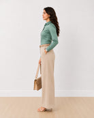 Dame sage green tailored shirt with a slim fitted silhouette, side profile view