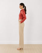 Dame terracotta brown tailored shirt with a fitted snug silhouette, side profile view