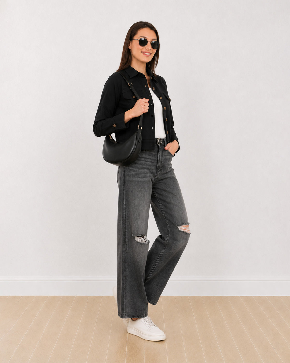 Dani black cropped trucker jacket with epaulet cuff tabs and metallic buttons, angled front view
