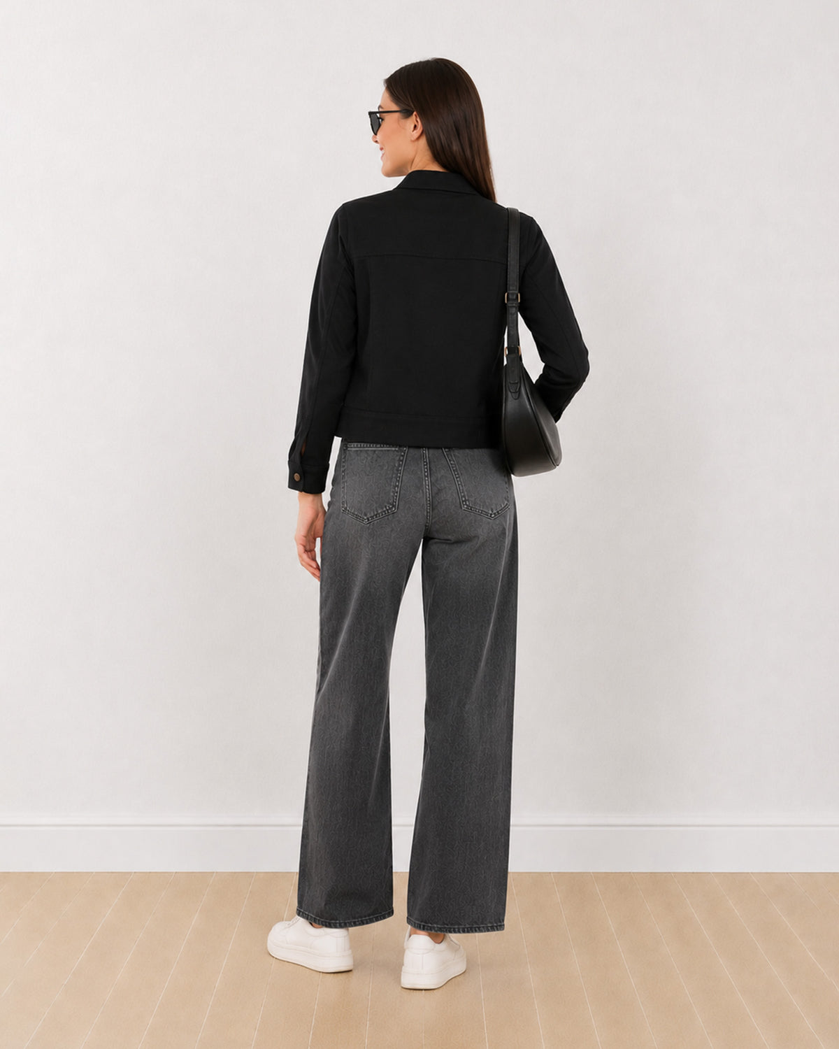Dani black cropped trucker jacket, back view showing the boxy fit and straight hem