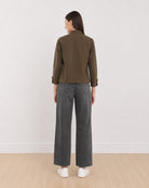 Dani olive green cropped trucker jacket, back view showing the back yoke and straight hem
