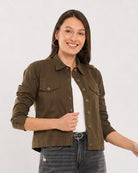 Dani olive green trucker jacket worn open showing the flap pockets, front view