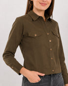 Close-up of Dani olive green trucker jacket collar, flap pockets and metallic buttons