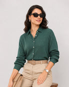 Daphne bottle green viscose shirt with silver lurex stripes and drop shoulder sleeves, angled front view