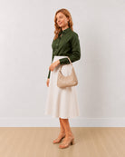 Darleen olive green formal shirt with front waist darts for a snug fit, angled front view