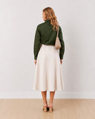 Darleen olive green formal shirt, back view showing the back waist darts and buttoned cuffs