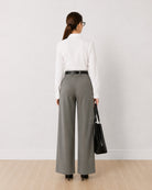 Darleen white formal shirt, back view showing the back waist darts and buttoned cuffs