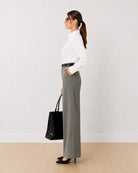 Darleen white tailored shirt with a curved hem and full sleeves, side profile view