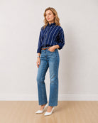 Darlina navy blue striped shirt with an oversized fit and rolled sleeves, angled front view