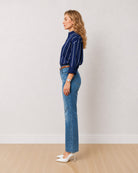 Darlina navy blue striped oversized shirt with a drop shoulder, side profile view