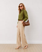 Darlina olive green striped oversized shirt with rolled sleeves, angled front view