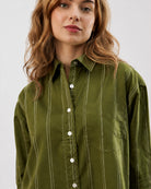 Darlina olive green striped shirt with a drop shoulder and patch pocket, front view