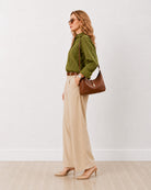 Darlina olive green striped oversized shirt with a drop shoulder, side profile view