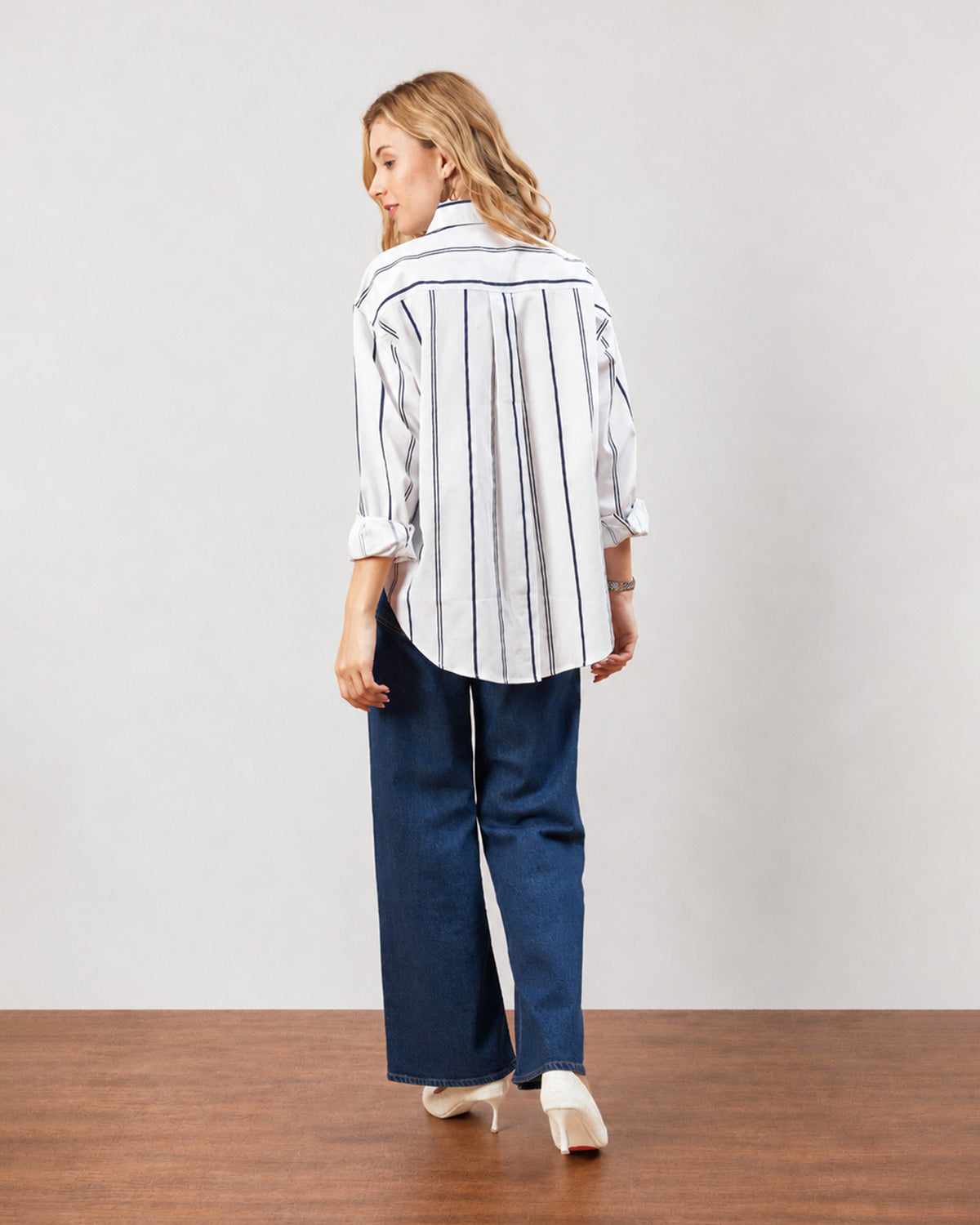 Darlina white striped shirt, back view showing the striped back and long curved hem