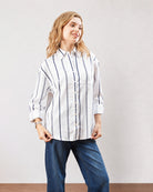 Darlina white striped shirt with an oversized drop shoulder fit, front view
