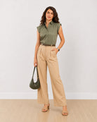 Darren sage green 100% cotton cap sleeves shirt with a relaxed fit, angled front view