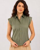 Darren sage green shirt showing the metal studded cap sleeve and placket with metal buttons