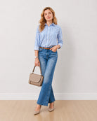 Dede blue and white striped 100% organic cotton shirt with a relaxed fit, angled front view