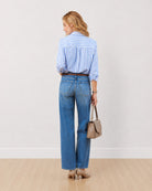 Dede striped cotton shirt, back view showing the horizontal striped yoke and centre back pleat