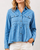 Delta light blue denim peplum shirt detail, two chest pockets and gathers at the waist