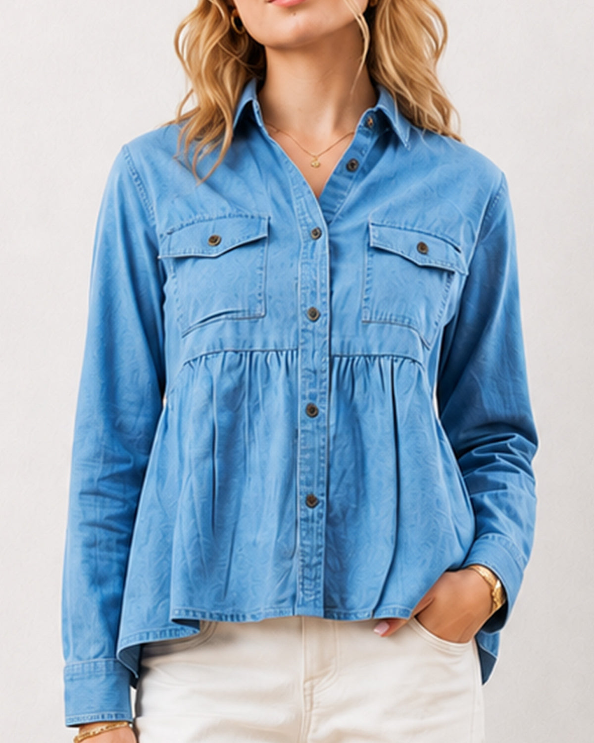 Delta light blue denim peplum shirt detail, two chest pockets and gathers at the waist
