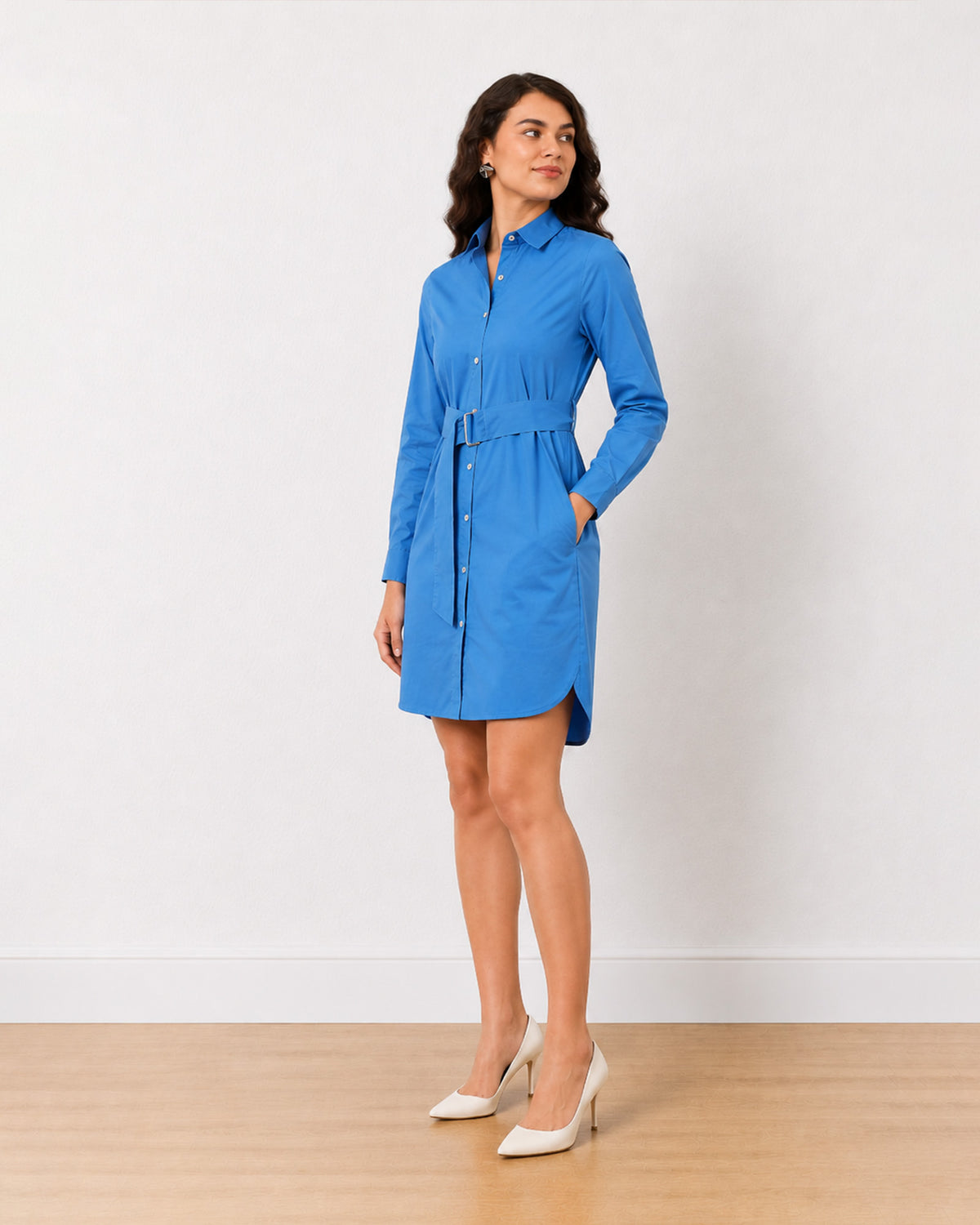 Demi bright blue shirt dress, angled front view with hand in the side pocket