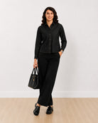 Desire black 100% cotton denim shirt, full length walking front view worn untucked
