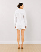 Destiny white embroidered co-ord set, back view of the long curved hem shirt