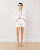 Gazillion Destiny white embroidered co-ord set for women, full length front view with shirt tucked into shorts