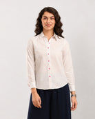 Dew multi-colour splatter print shirt, waist up front view with contrast pink buttons