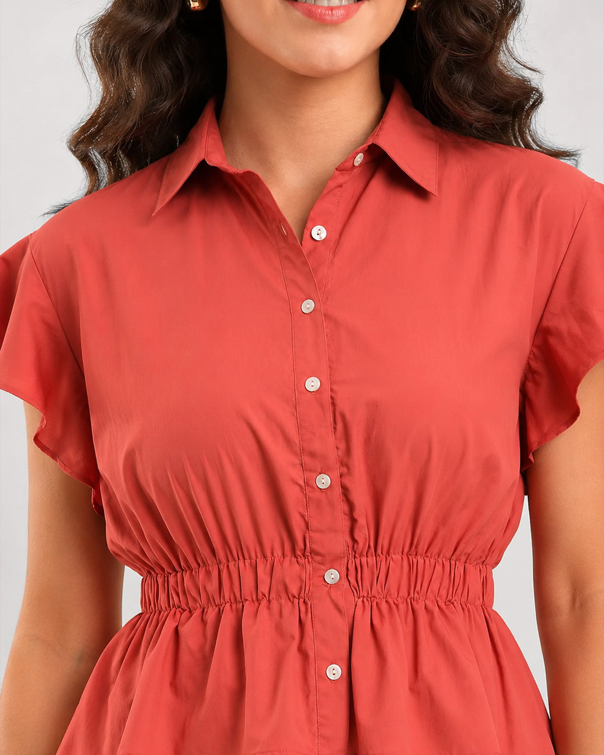 Diamond brick red peplum shirt detail, elasticated peplum waist and flared sleeve