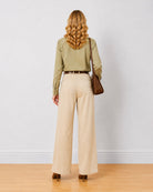 Diane beige mid waist formal trousers, back view of the full length wide leg fit