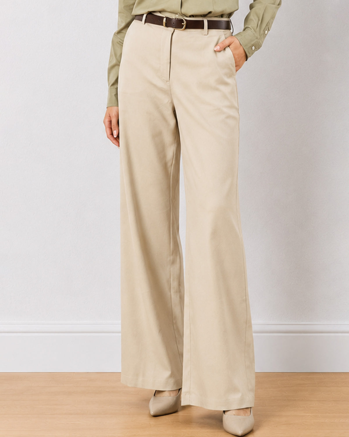 Diane beige formal trousers, waist down front view with hand in side cross pocket