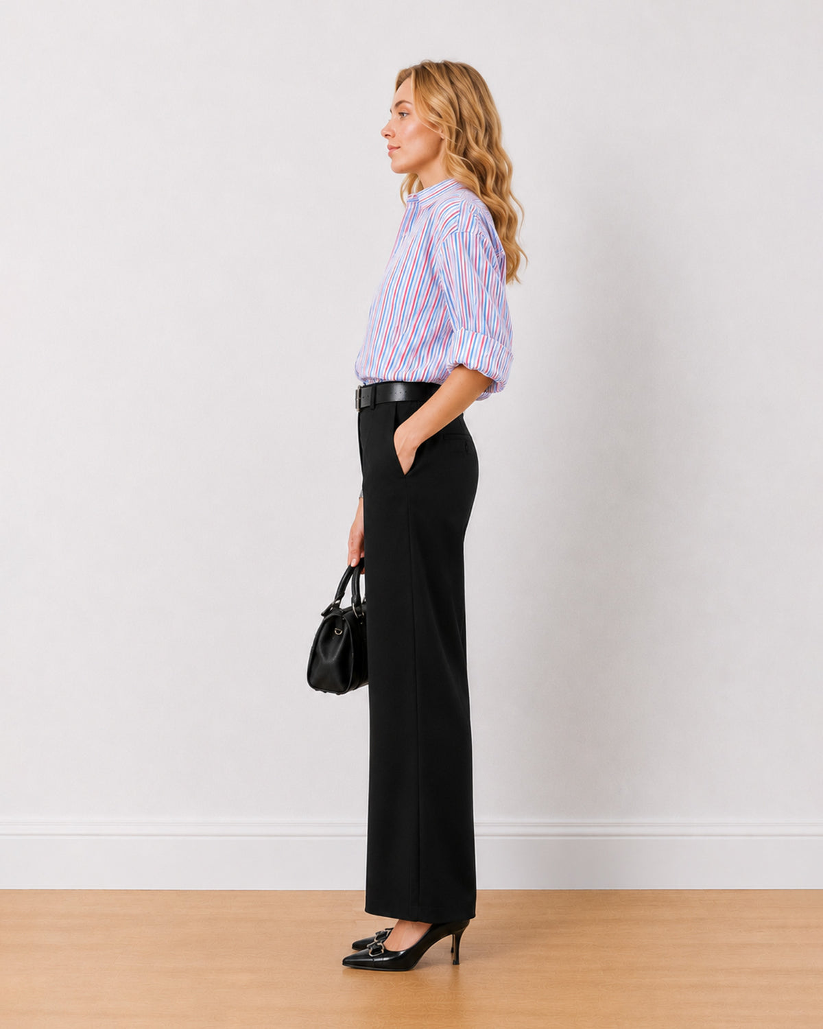 Diane black mid waist formal trousers, side profile view of the full length wide leg