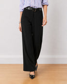 Diane black formal trousers, waist down front view of the mid waist wide leg fit