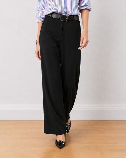 Diane black formal trousers, waist down front view of the mid waist wide leg fit