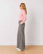 Diane grey formal trousers, side profile view of the full length wide leg
