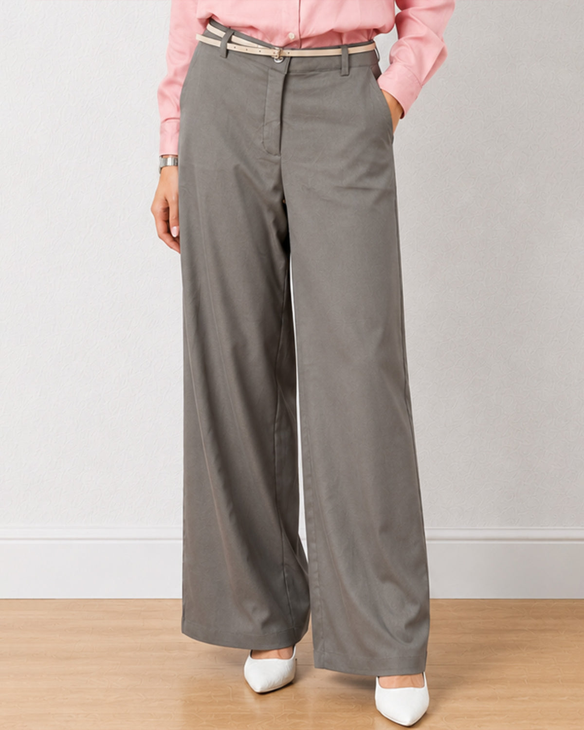 Diane grey formal trousers, waist down front view with hand in the side cross pocket